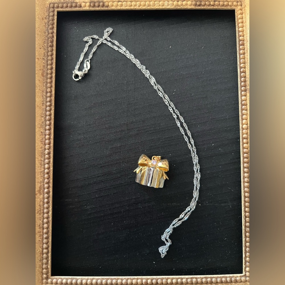 Elegant Gold and Silver Bow Pendant Necklace